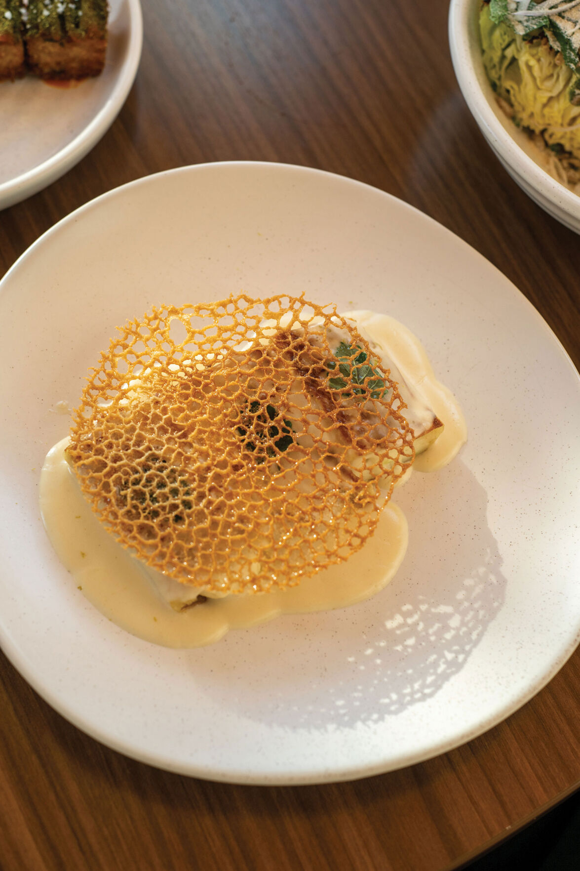 Scallop-stuffed crêpe with nam prik blanquette and lace tuile at Bad Idea